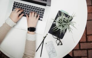 A woman typing with all fingers